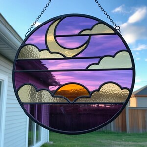 Stained Glass Sunset Moon – Crescent Moon with Cream Clouds and Golden Sun on Purple and Pink Sky