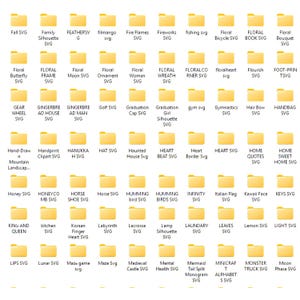 May include: A digital display of numerous yellow folder icons arranged in a grid, each labelled with text identifying various SVG design categories such as Fall, Floral, Graduation, Heart, Horse, Kitchen, and Moon, organised in alphabetical order.