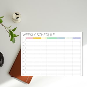 May include: A printable weekly schedule planner with a white background and colourful headers for each day of the week. The days of the week are labelled Monday through Sunday. The time slots are listed in half-hour increments from 7:00 AM to 9:00 PM.