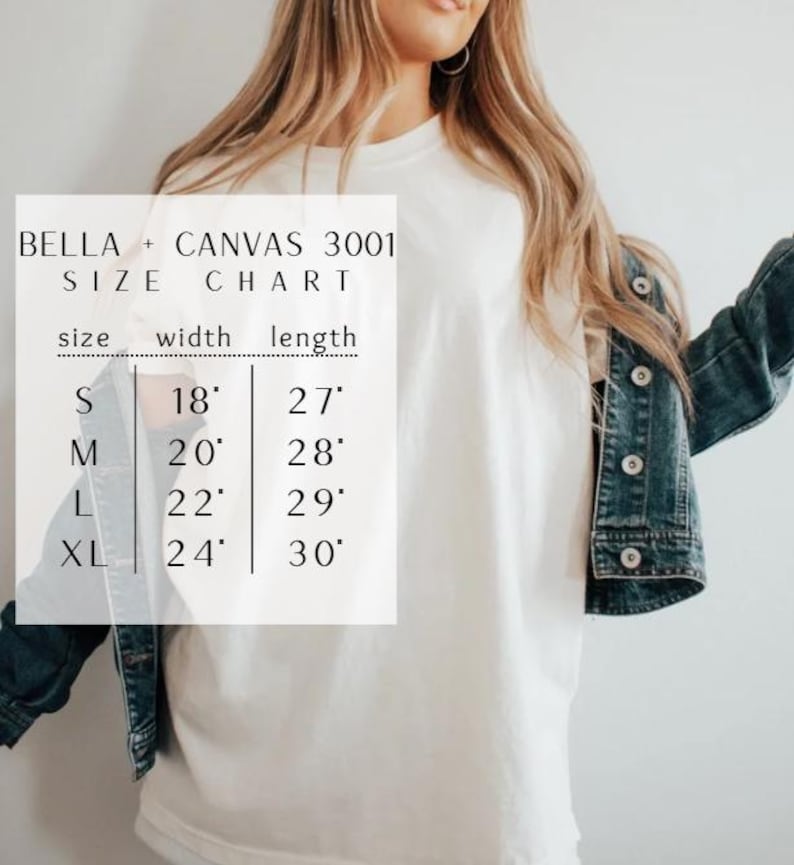 May include: A white t-shirt worn under a dark blue denim jacket, overlaid with a Bella + Canvas 3001 size chart. The chart lists sizes S, M, L, and XL with corresponding widths of 18, 20, 22, and 24 inches and lengths of 27, 28, 29, and 30 inches.