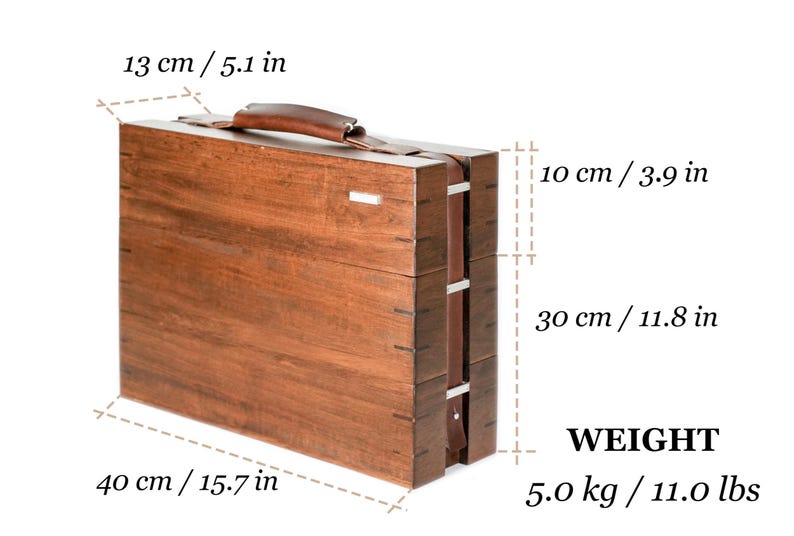 May include: A rectangular wooden carrying case with a brown leather handle, measuring 15.7 inches long, 5.1 inches wide, and 11.8 inches high, with a total weight of 11.0 lbs. The case features visible joinery and a small silver-toned metal accent.