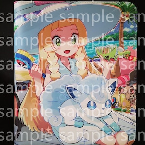 May include: A light blue and white illustrated cover featuring a cartoon character with long blonde hair, a large sun hat, and a white and blue fox-like creature. The background shows a beach scene with palm trees and the ocean.