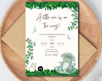 May include: A baby shower invitation with a green leafy border and illustrations of characters from the movie My Neighbor Totoro. The text reads "A little one is on the way!" and includes details for the event, such as the date, time, and RSVP information.