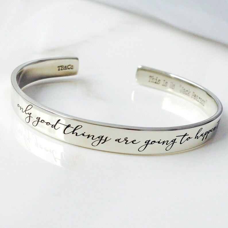 May include: Silver bangle bracelet with the inscription "only good things are going to happen".