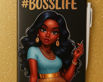 May include: Black notebook with gold glitter text reading "#BOSSLIFE". The cover features an illustration of a woman with dark hair, gold jewellery, and a blue top. A white pen is placed on the right side of the notebook.