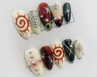 Uñas postizas coloridas Y2K con diseño abstracto único de estrellas y remolinos, tachuelas plateadas y pegamento, juego de uñas moderno.