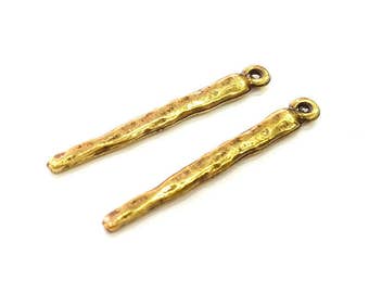 May include: Two gold-toned metal connector pieces with a textured finish and a small loop at the top. These pieces are ideal for jewelry making or other craft projects.