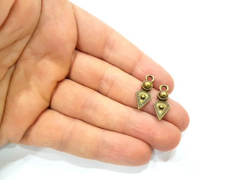 G10930 10 Antique Bronze Charm Antique Bronze Plated Metal 22x8mm