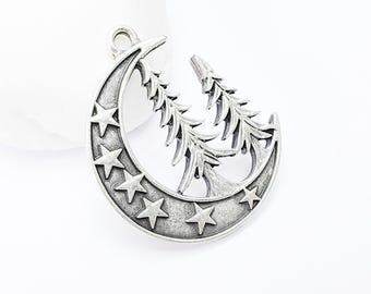 May include: Silver charm pendant featuring a crescent moon with five stars and two stylised pine trees.