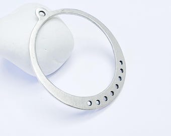 May include: Silver-toned metal hoop with a small hole at the top and a row of evenly spaced holes along the bottom edge.