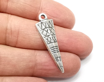 May include: Silver charm in the shape of a triangle with a geometric pattern. The charm has a loop at the top for attaching to a necklace or bracelet.