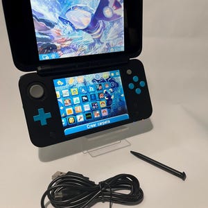 NIEUWE originele Nintendo 2DS XL gemodificeerd / 64 GB geheugenkaart / Regiovrij / Oplader inbegrepen / Games eenvoudig te installeren