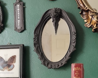 Gothic black oval mirror with magpie skull detail | Gothic Victorian Home Decor