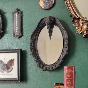 Gothic black oval mirror with magpie skull detail | Gothic Victorian Home Decor