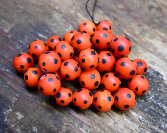 Black on Tomato Red Skunk Beads