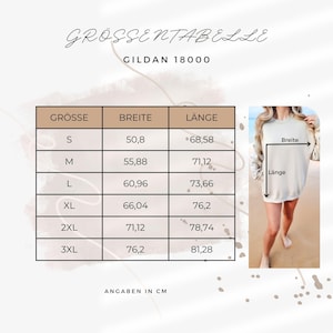 Op de afbeelding: Maattabel voor een Gildan 18000 sweatshirt, met afmetingen in centimeters. De tabel bevat maten S tot 3XL, met bijbehorende breedte- en lengtematen. Een persoon draagt het sweatshirt.