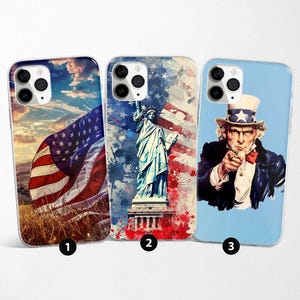 May include: Three phone cases with patriotic designs. One case features an American flag waving in a field. Another showcases the Statue of Liberty with a flag background. The third displays Uncle Sam pointing, with a blue background.