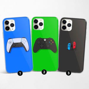 May include: Three phone cases in blue, green, and black. Each case features a different game controller design: a white and black PlayStation controller, a black Xbox controller, and a blue and red Nintendo Switch controller.