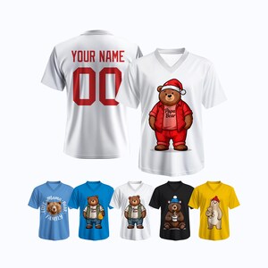 May include: White V-neck t-shirts with bear illustrations. One shirt has "Your Name" and the number "00" on the back. Other shirts feature bears in outfits, including a Santa hat, overalls, and holding a coffee cup.