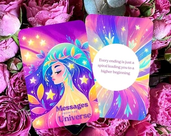 May include: Two oracle cards featuring illustrations of a woman with blue hair and stars. The cards display the text "Messages from the Universe" and "Every ending is just a spiral leading you to a higher beginning". The cards are set against a backdrop of pink roses.