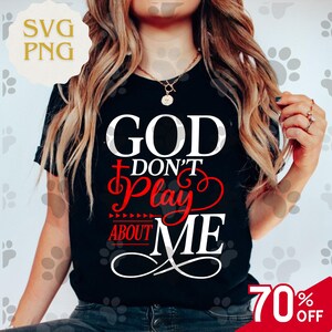 May include: Black t-shirt with the text "GOD DON'T Play ABOUT ME" in white and red. The shirt has a round neckline and short sleeves. A "70% OFF" graphic is in the bottom right corner.
