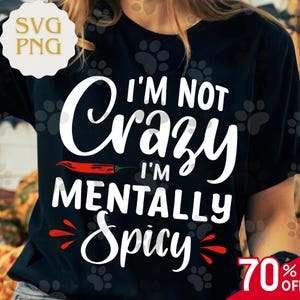 May include: Black t-shirt with the white text "I'M NOT Crazy I'M MENTALLY Spicy" and a red chili pepper graphic. The shirt also has a "70% OFF" sale tag in the bottom right corner.
