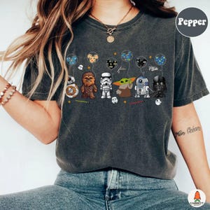 May include: A handcrafted wooden sign, painted white with black lettering, reading "Welcome to our home". The sign has a handwritten style and a small heart detail. Suitable for indoor or outdoor display.