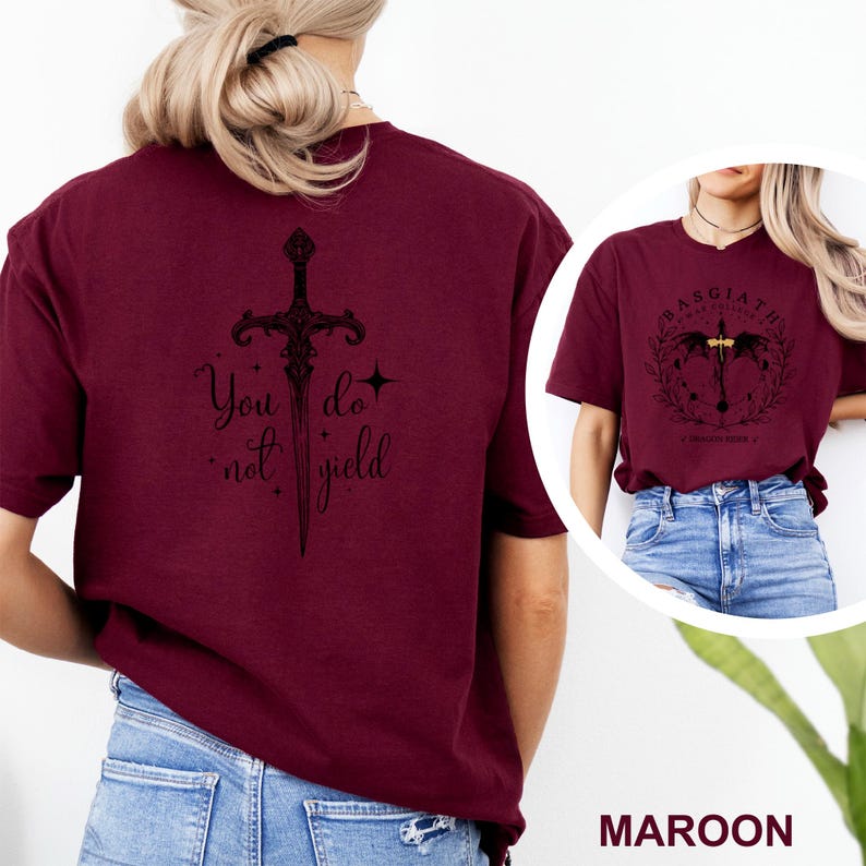 May include: Maroon t-shirt with a black sword graphic and the text "You do not yield." A smaller image shows a similar shirt with a circular design and the text "Basgiath War College."