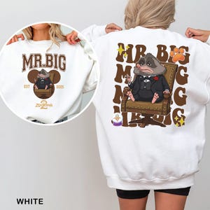May include: White sweatshirt featuring a cartoon illustration of Mr. Big from Zootopia. The front design includes the text "MR. BIG" and "ZOOTOPIA 2025". The back design shows Mr. Big in a suit, seated in a chair, with the text "MR. BIG".