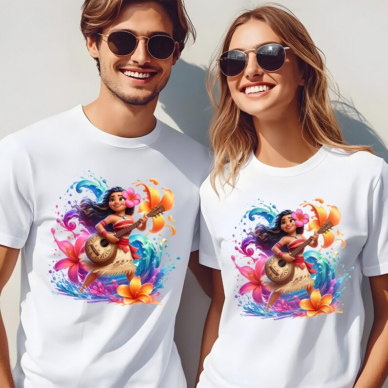 May include: White t-shirts featuring a colorful graphic of a cartoon character playing a ukulele, surrounded by flowers and water splashes. The character wears a flower in their hair and a traditional skirt. The shirts are worn by two people.