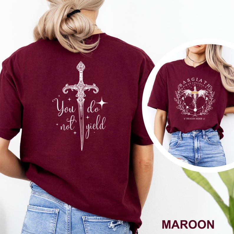 May include: Maroon t-shirt with a white graphic of a sword and the text "You do not yield." A second image shows a similar shirt with a circular design and the text "Basgiath War College."
