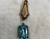 Vintage crystal,blue crystal attached to a beautiful aged bronze in color finding,necklace part,earring parts,