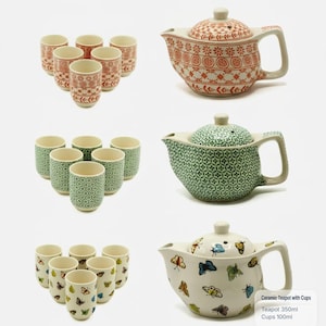 May include: Three sets of ceramic teapots and six matching cups. One set features orange geometric patterns, one set has green floral motifs, and one set displays colourful butterflies. Each teapot holds 350ml and each cup holds 100ml.