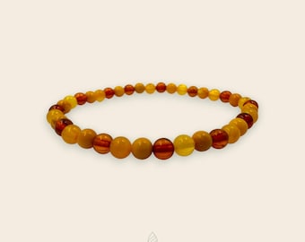 Ámbar báltico puro, tonos cálidos del atardecer: alivio natural del estrés y calma. Joyería de piedras preciosas auténticas. Regalo ético para cualquier ocasión.