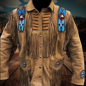 May include: A brown suede jacket with fringe detailing and beaded accents. The jacket features a Native American inspired design with eagle motifs and geometric patterns.