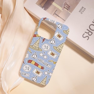 May include: A light blue phone case featuring a repeating pattern of iconic imagery. The design includes a sorting hat, lightning bolts, glasses, a scarf, and the text "HOGWARTS" and "9 3/4". The case is a protective accessory for a smartphone.