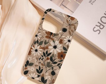 May include: A phone case with a floral pattern. The case features a beige background with white, brown, and green flowers and leaves. The case is designed to fit a smartphone and has cutouts for the camera and buttons.