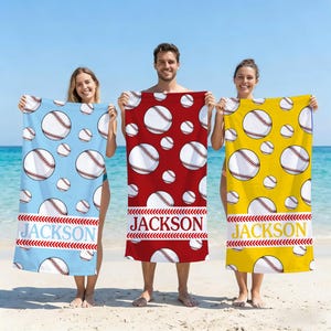 May include: Three beach towels with baseball designs. One is light blue, one is red, and one is yellow. Each towel has a repeating pattern of baseballs and the name "JACKSON" in a banner across the bottom.
