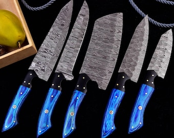 May include: Set of five kitchen knives with blue handles and Damascus steel blades. The blades have a wavy pattern and the handles are a dark blue with a light blue swirl.