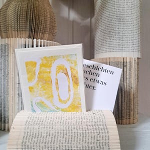 Gefaltetes Buch, Buchfaltkunst, Deko-Objekt aus Papier, Kartenhalter aus Papier, Visitenkartenhalter aus Papier