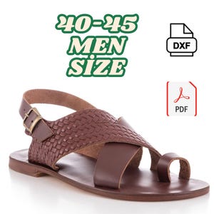 May include: Brown leather sandal with woven detailing and a toe loop. The sandal features a buckle closure and a flat sole. The image includes the text "40-45 MEN SIZE" in green, along with DXF and PDF icons.