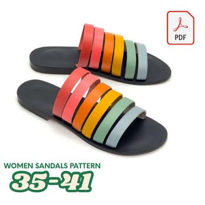 May include: A pair of colorful sandals with a rainbow strap design. The sandals have a black sole and a series of straps in shades of pink, orange, yellow, green, and blue. The image also includes the text "WOMEN SANDALS PATTERN 35-41" and a PDF icon.