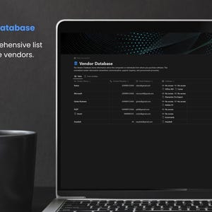 May include: A laptop computer screen displaying a database of software vendors with their contact information. The text "License key Database" and "Vendor Database" is visible on the screen. A black coffee mug with the letter "N" is in the foreground.