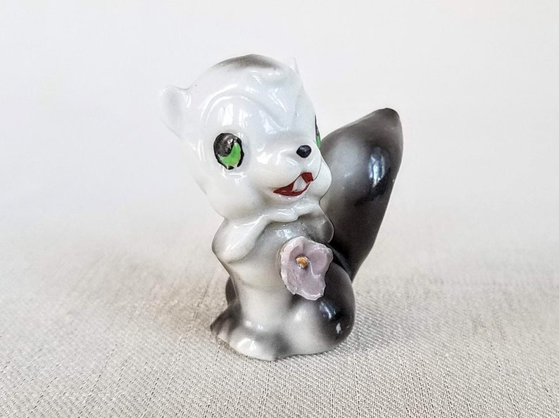 Made in Japan Cute Little Vintage Ceramic Skunk Figurine Vintage 1960s Porcelain Ceramic Skunk Figurine Holding a Flower