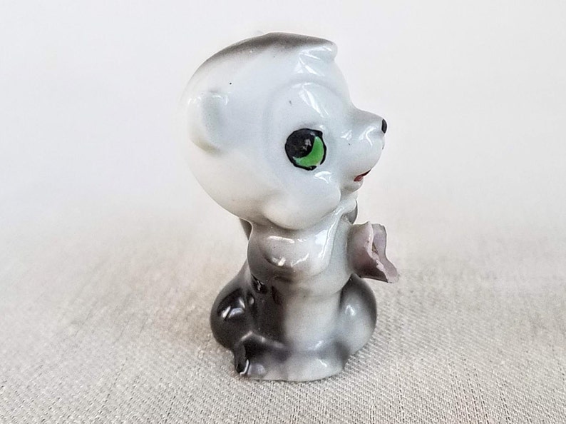 Made in Japan Cute Little Vintage Ceramic Skunk Figurine Vintage 1960s Porcelain Ceramic Skunk Figurine Holding a Flower