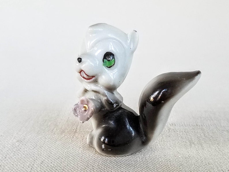 Made in Japan Cute Little Vintage Ceramic Skunk Figurine Vintage 1960s Porcelain Ceramic Skunk Figurine Holding a Flower