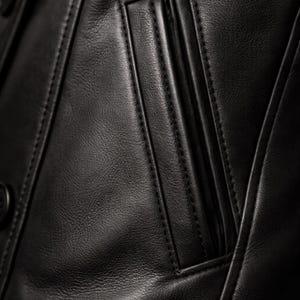 Genuine leather men peacoat pocket detail - handmade stitching and authentic black leather texture