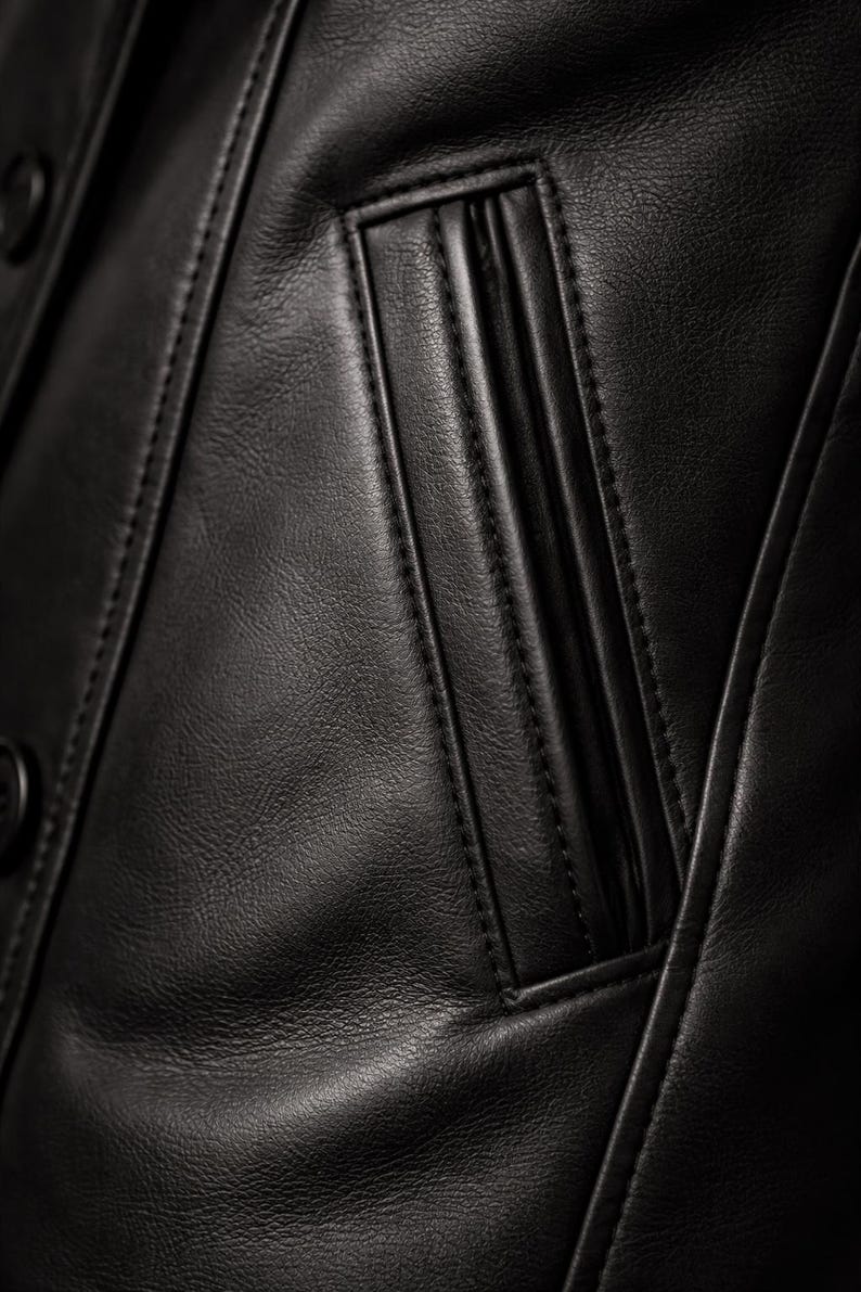 Genuine leather men peacoat pocket detail - handmade stitching and authentic black leather texture
