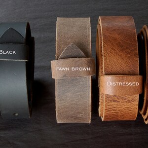 May include: Five leather belts in different colors and textures. From left to right: Dark Brown, Black, Fawn Brown, Distressed, Mahogany.