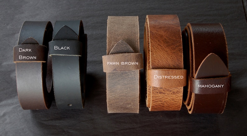 May include: Five leather belts in different colors and textures. From left to right: Dark Brown, Black, Fawn Brown, Distressed, Mahogany.